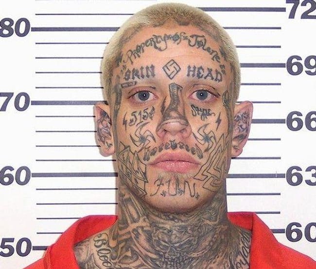Nazis: Poor Tenets, Poorer Tas... is listed (or ranked) 2 on the list The Most Out-Of-Control Face Tattoos Captured By The Mugshot Camera