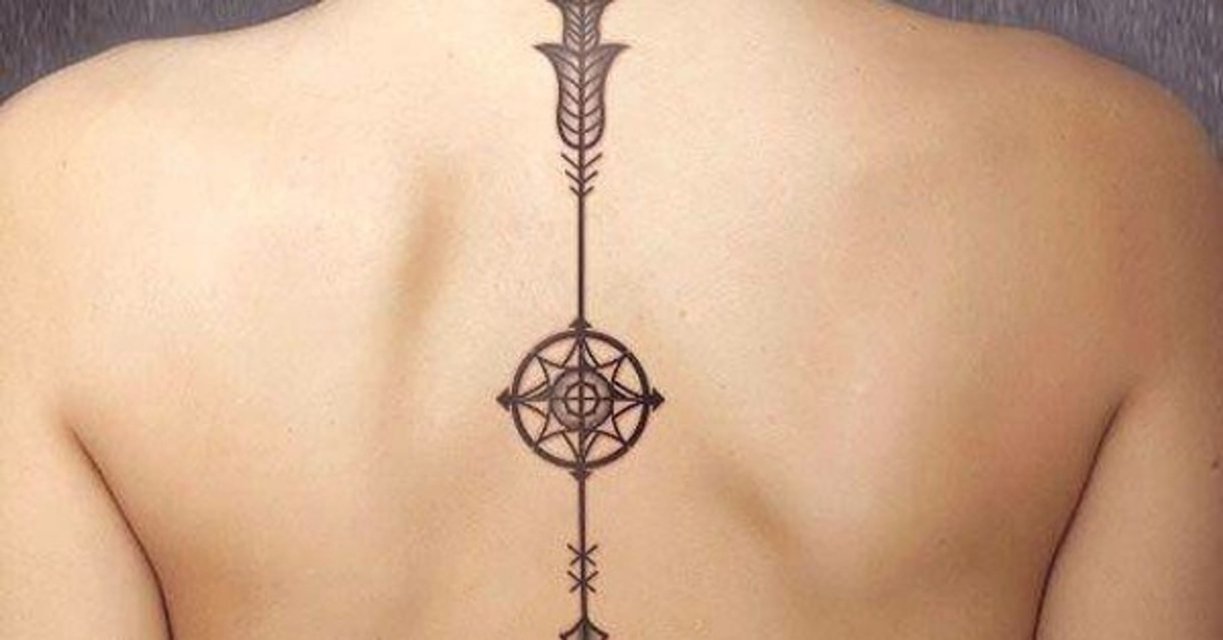 tribal spine tattoo