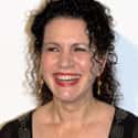 age 63   Susan "Susie" Essman is an American stand-up comedian, actress, writer and television producer, best known for her role as Susie Greene on Curb Your Enthusiasm and the voice of Mittens
