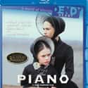 Anna Paquin, Holly Hunter, Harvey Keitel   The Piano is a 1993 romantic drama film about a mute female piano player and her daughter.