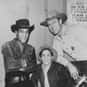 Chuck Connors, Johnny Crawford, Paul Fix   The Rifleman is an American Western television program starring Chuck Connors as rancher Lucas McCain and Johnny Crawford as his son, Mark McCain.