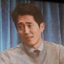 age 35   Steven Yeun (born December 21, 1983) is a Korean-American actor and voice actor. He is known for his role as Glenn Rhee on AMC's horror drama television series The Walking Dead.