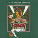 Alan Menken , Howard Ashman   Little Shop of Horrors is a comedy horror rock musical, by composer Alan Menken and writer Howard Ashman, about a hapless florist shop worker who raises a plant that feeds on human blood and...