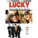 John Travolta, Lisa Kudrow, Michael Moore   Lucky Numbers is a 2000 comedy film directed by Nora Ephron.