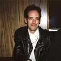 age 63   Michael Geoffrey "Mick" Jones is a British musician, guitarist, vocalist and songwriter best known for his works with the Clash until his dismissal in 1983, then Big Audio Dynamite...