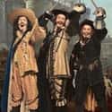 The Three Musketeers on Random Best Trios