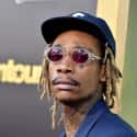 Hip hop music, Pop music   Cameron Jibril Thomaz, better known by the stage name Wiz Khalifa, is an American rapper.