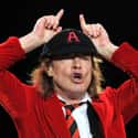 age 63   Angus McKinnon Young is a Scottish-born Australian guitarist best known as a co-founder, lead guitarist, and songwriter of the Australian hard rock band, AC/DC.