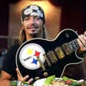 age 55   Bret Michael Sychak, professionally known as Bret Michaels, is an American singer-songwriter, musician, actor, director, screenwriter, producer, and reality television personality.