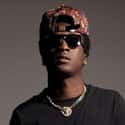 In Due Time   Kristopher Campbell, better known by his stage name K Camp, is an American rapper from Milwaukee, Wisconsin.
