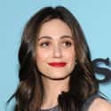 age 32   Emmanuelle Grey "Emmy" Rossum is an American actress and singer-songwriter. She has starred in movies including Songcatcher, An American Rhapsody, and Passionada.