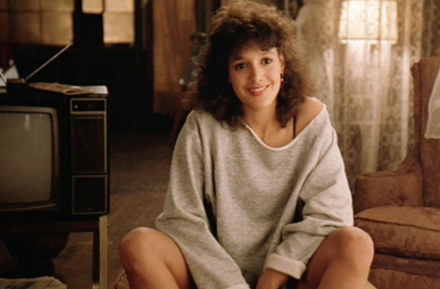 Torn, Off-The-Shoulder Sweatshirts Became Popular After 'Flashdance'