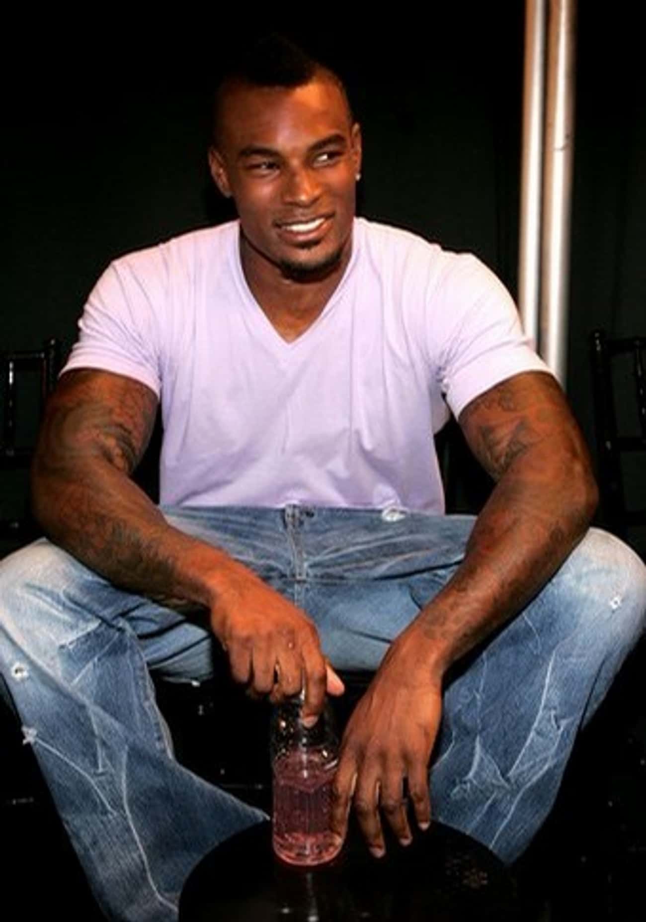 Tyson Beckford in V-Neck T-Shirt with Patch Straight Jeans
