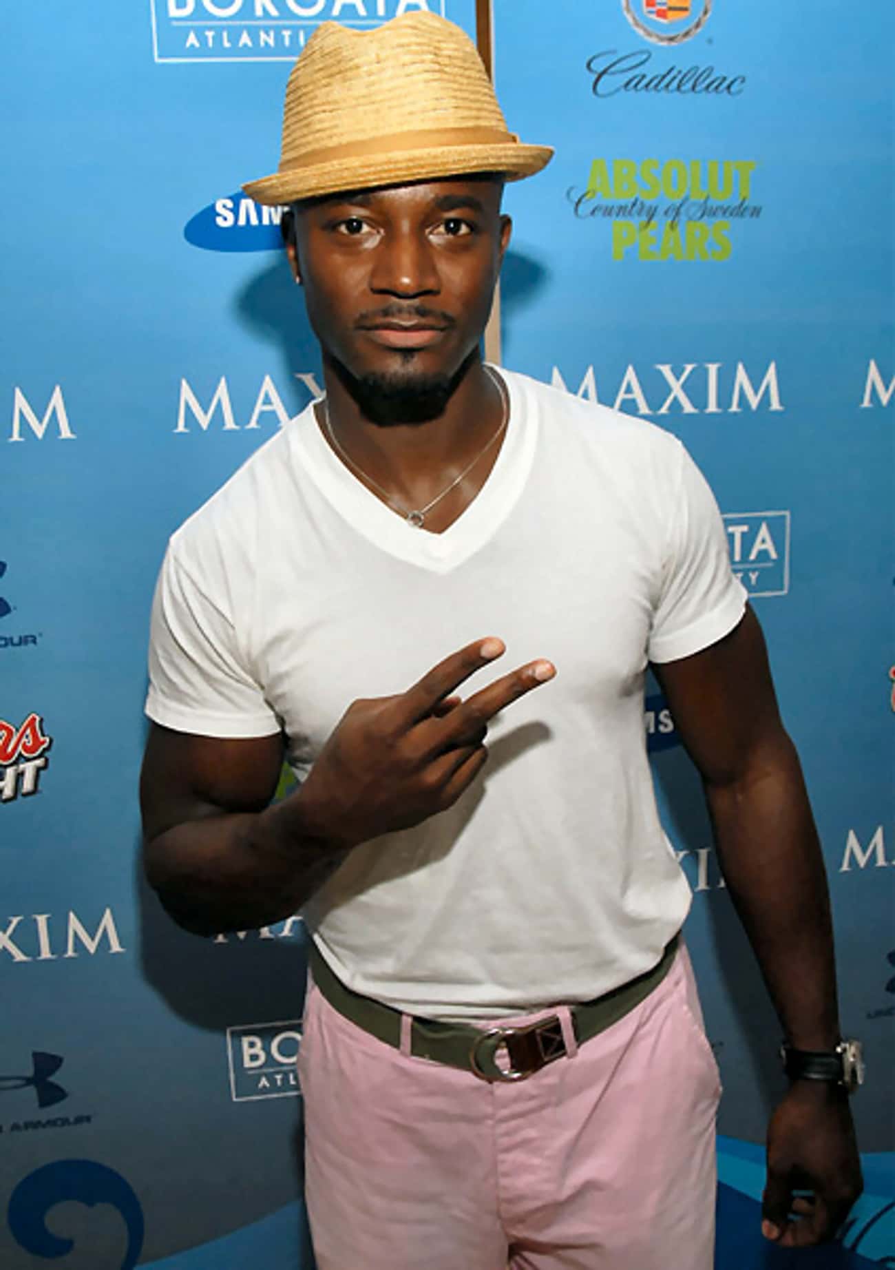 Taye Diggs in V-Neck T-Shirt with Yellow Hat