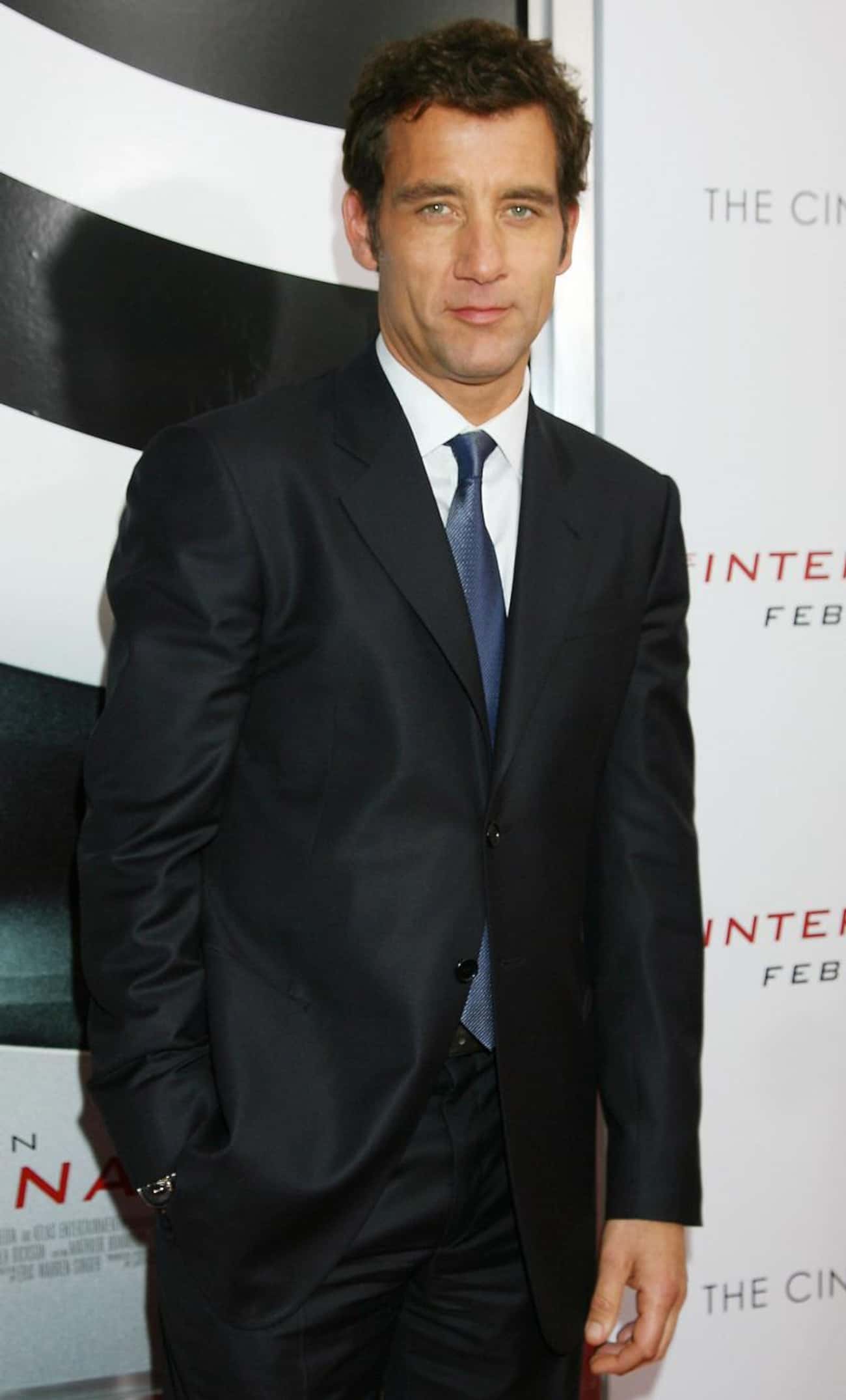 Clive Owen in Black Tux Paired with White Long Sleeves and Navy Blue Tie