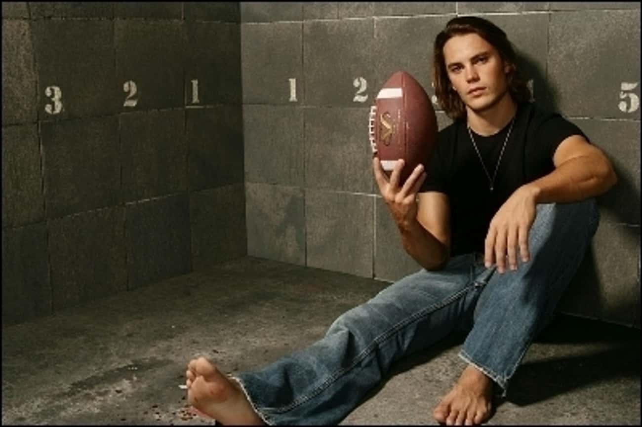Taylor Kitsch in Black T-Shirt with Straight Leg Jeans
