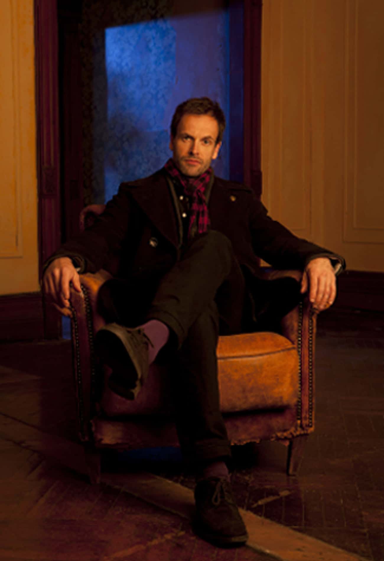 Jonny Lee Miller in Breasted Coat with Checkered Scarf