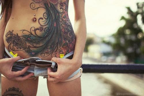 dainty stomach tattoos