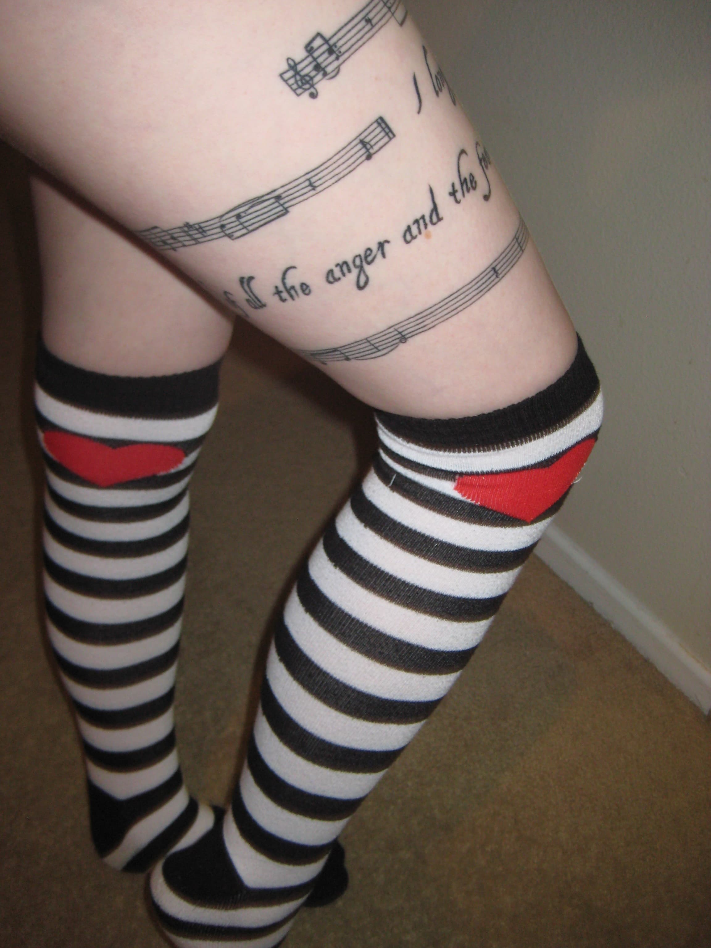 thigh wrap around tattoo