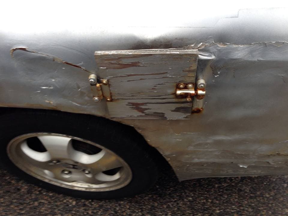 Wooden Secret Gas Door is listed (or ranked) 50 on the list 67 Insane Car Modification FAILs