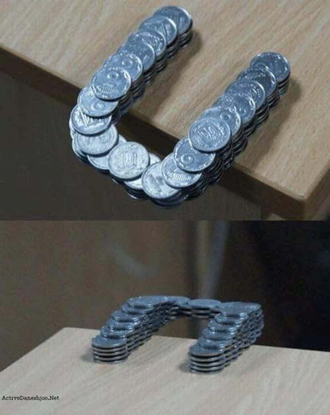 Coins Stacked Past The Edge Of The Table