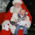Santa's Terrifying Toothless Grin on Random Kids Who Are Terrified of Santa Claus