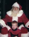 Serial Killer Santa About to Strangle This Kid on Random Kids Who Are Terrified of Santa Claus