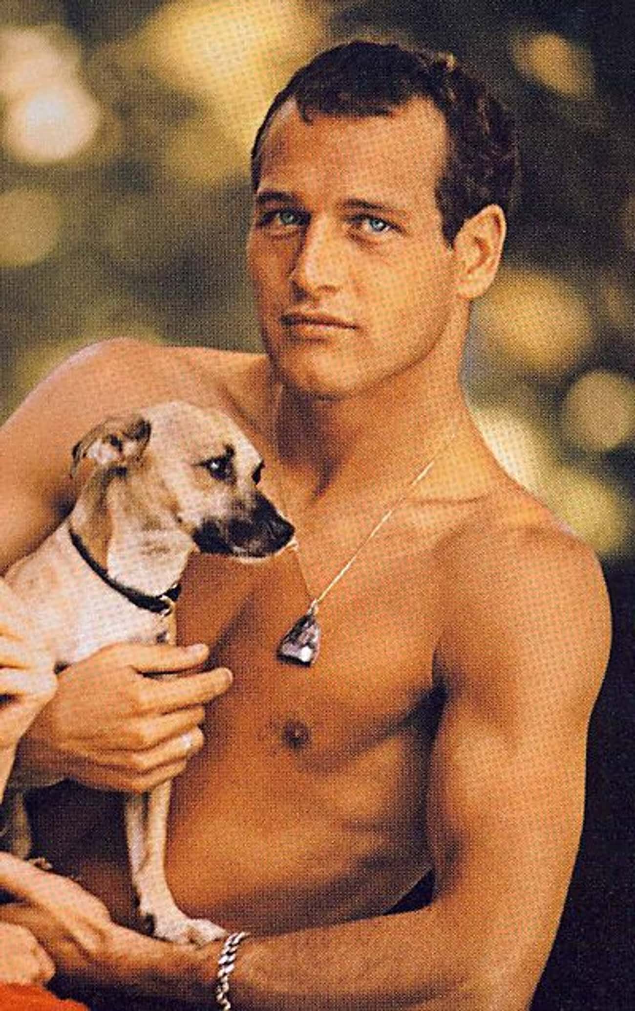 Young Paul Newman Holding Puppy