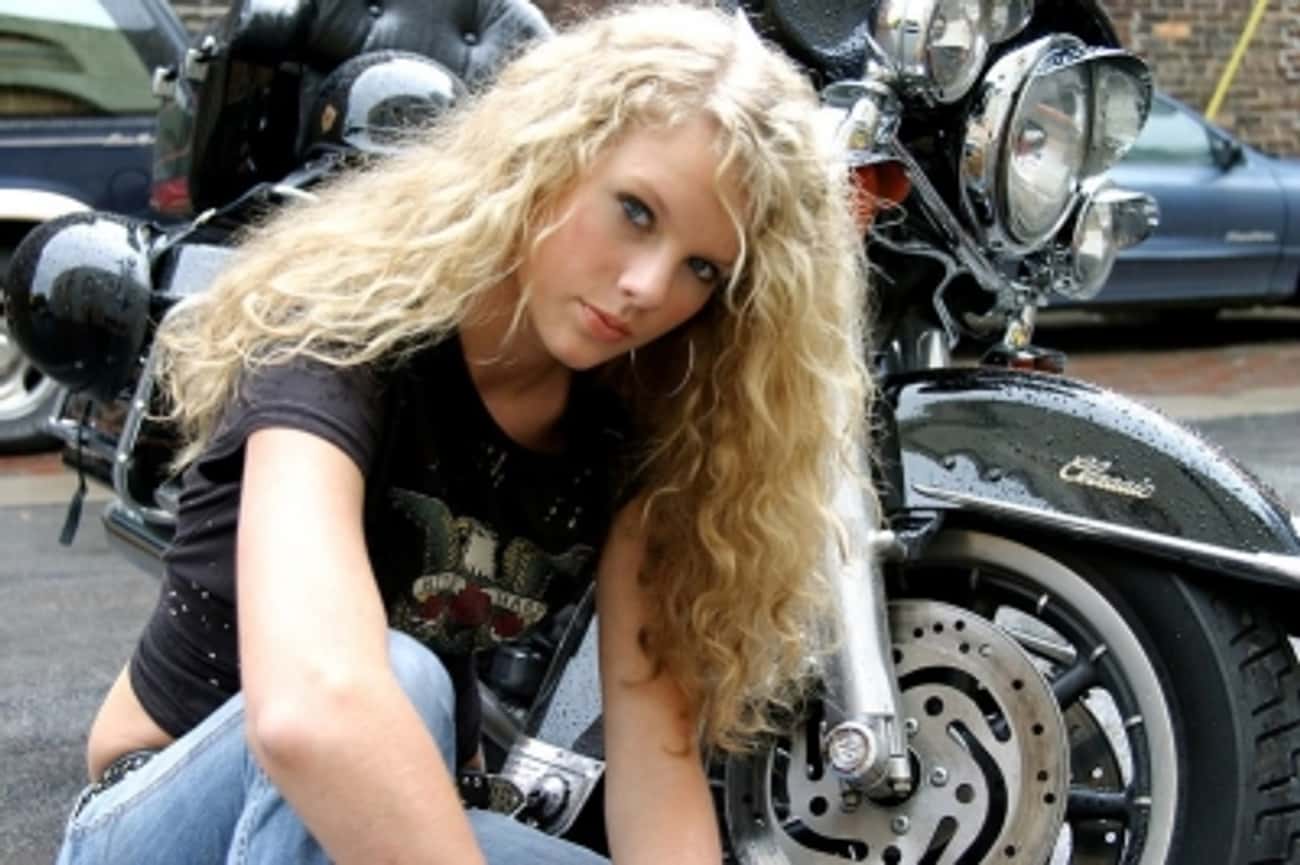 Young Taylor Swift in Front of a Motorcycle