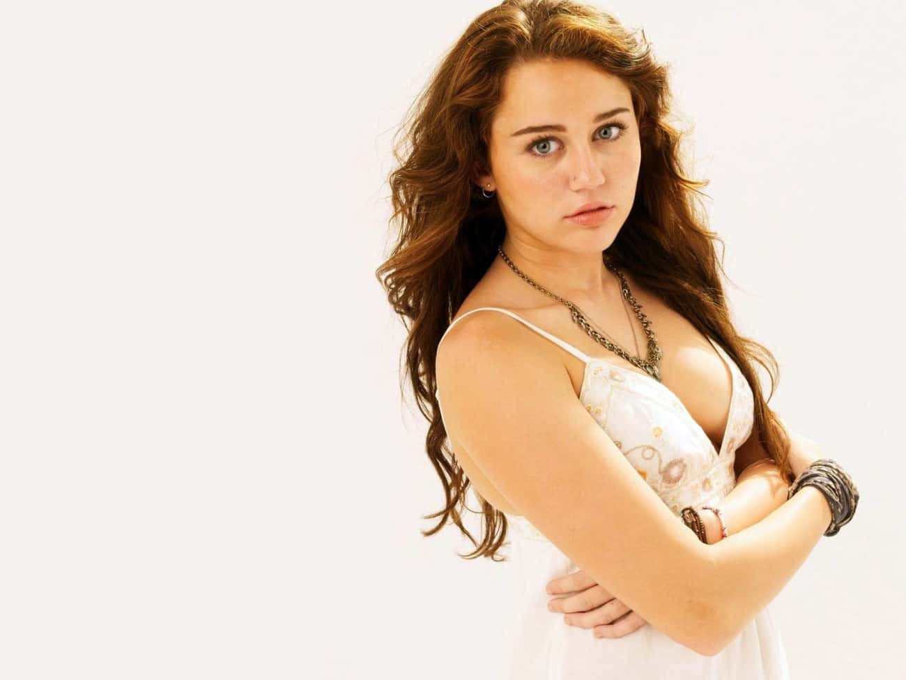 Young Miley Cyrus in White Spaghetti Strap Dress