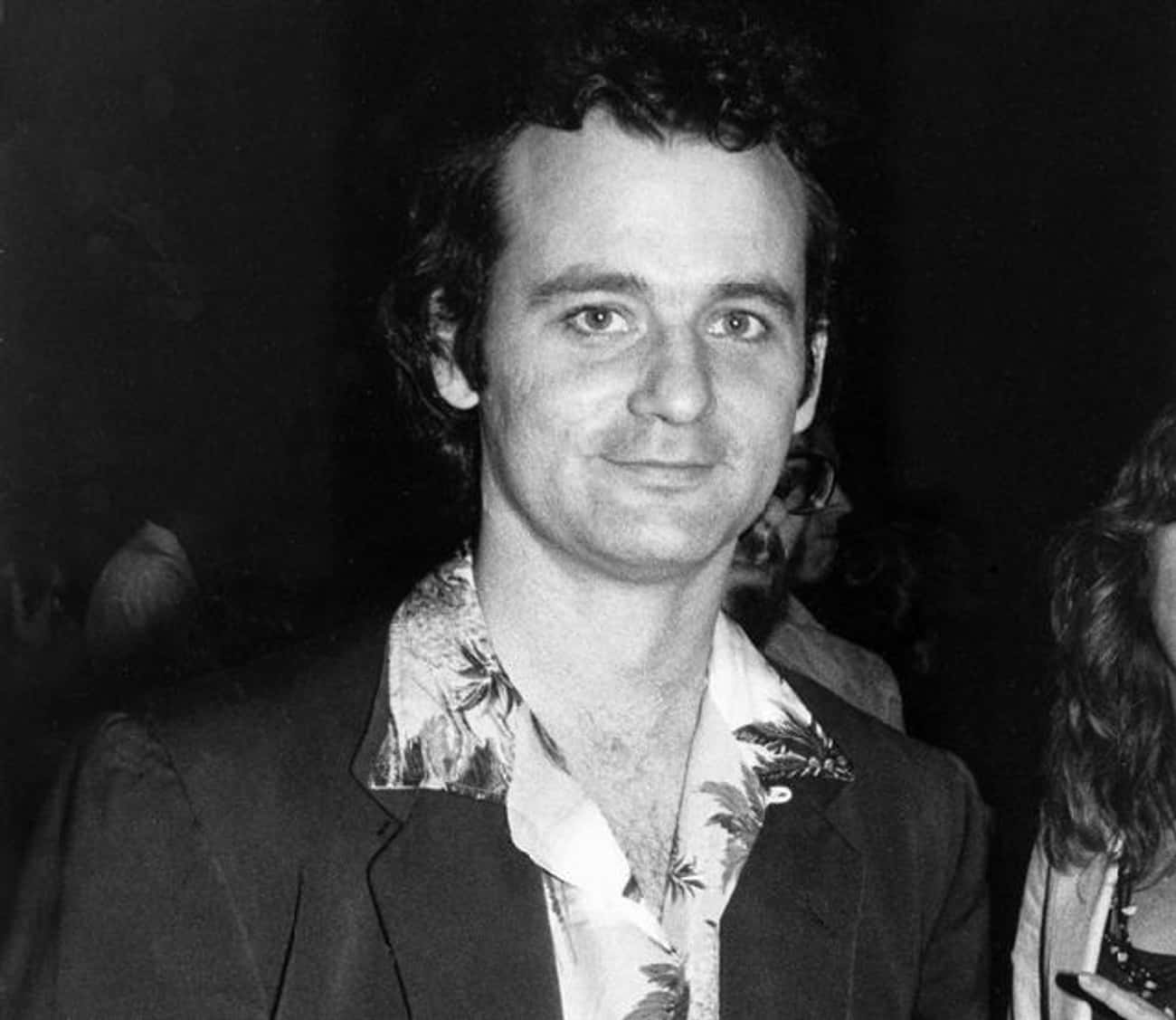 Young Bill Murray in a Black Coat and Hawiian Style Shirt