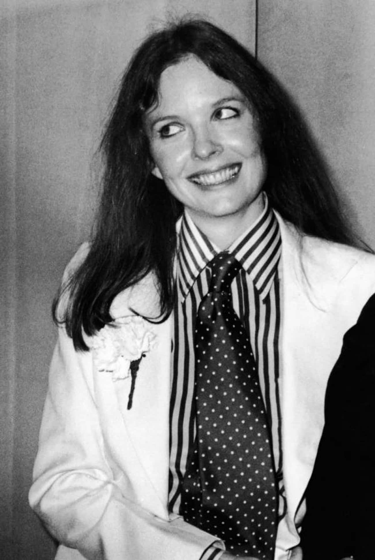 Young Diane Keaton in a White Coat and Striped Buttondown
