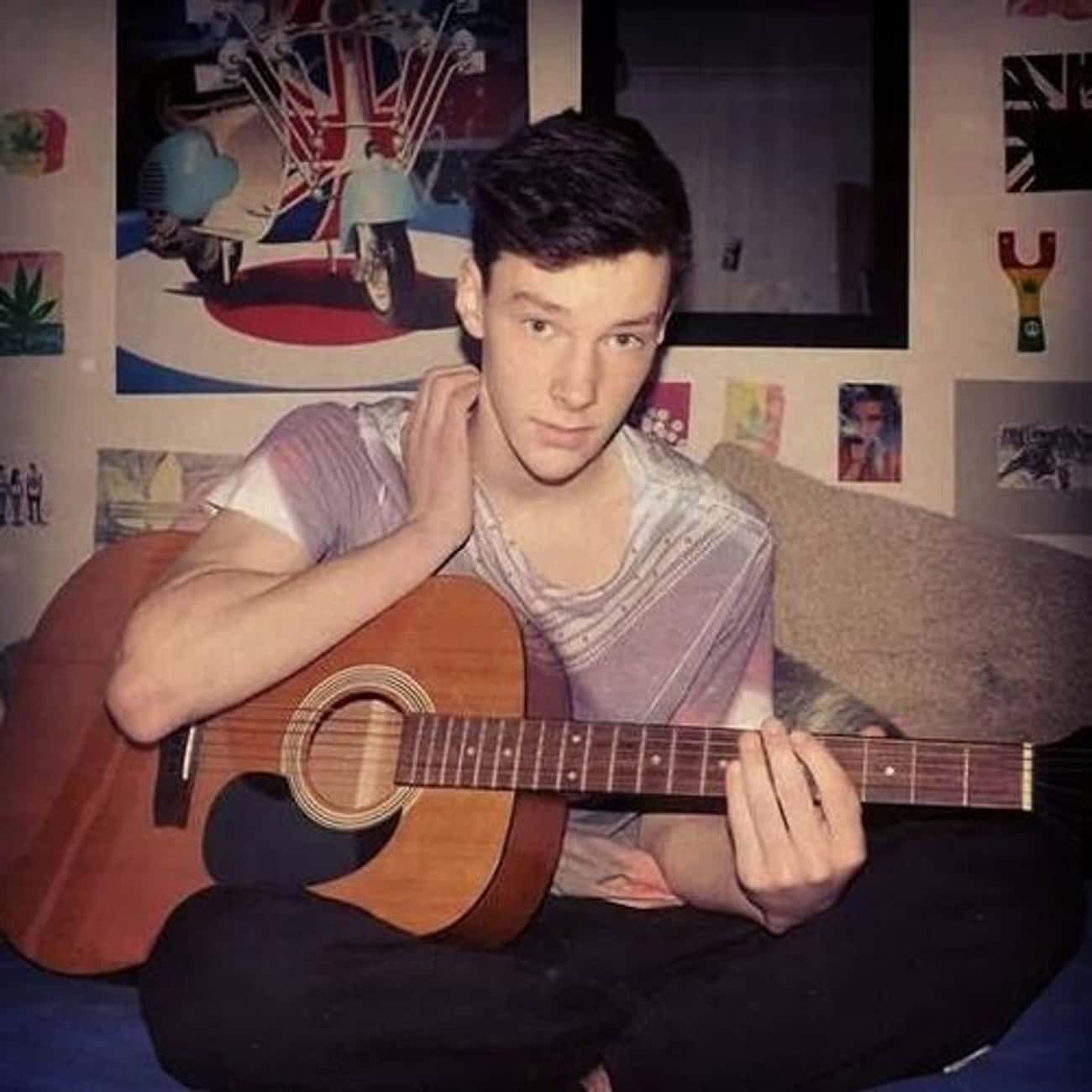 Young Benedict Cumberbatch Holding a Guitar