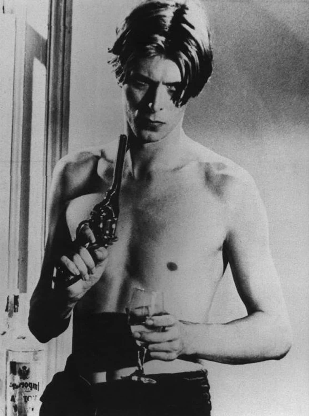 Young David Bowie Holding Gun Shirtless