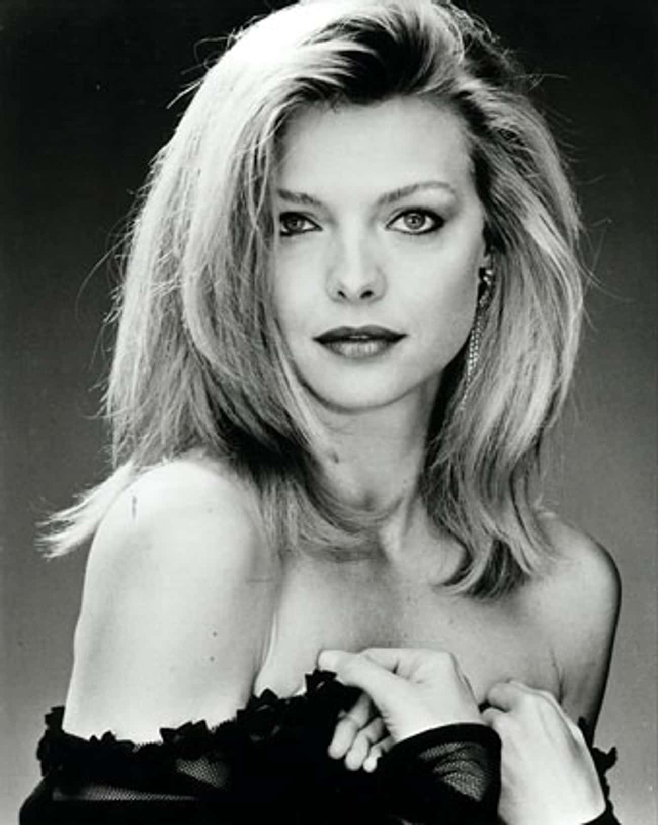 Young Michelle Pfeiffer in a Lowcut Black Blouse