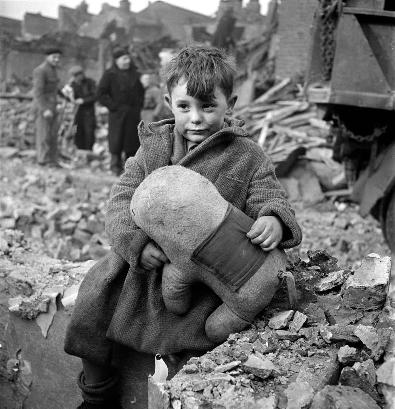 An Abandoned Boy Sitting Amid The Ruins Of His London Home