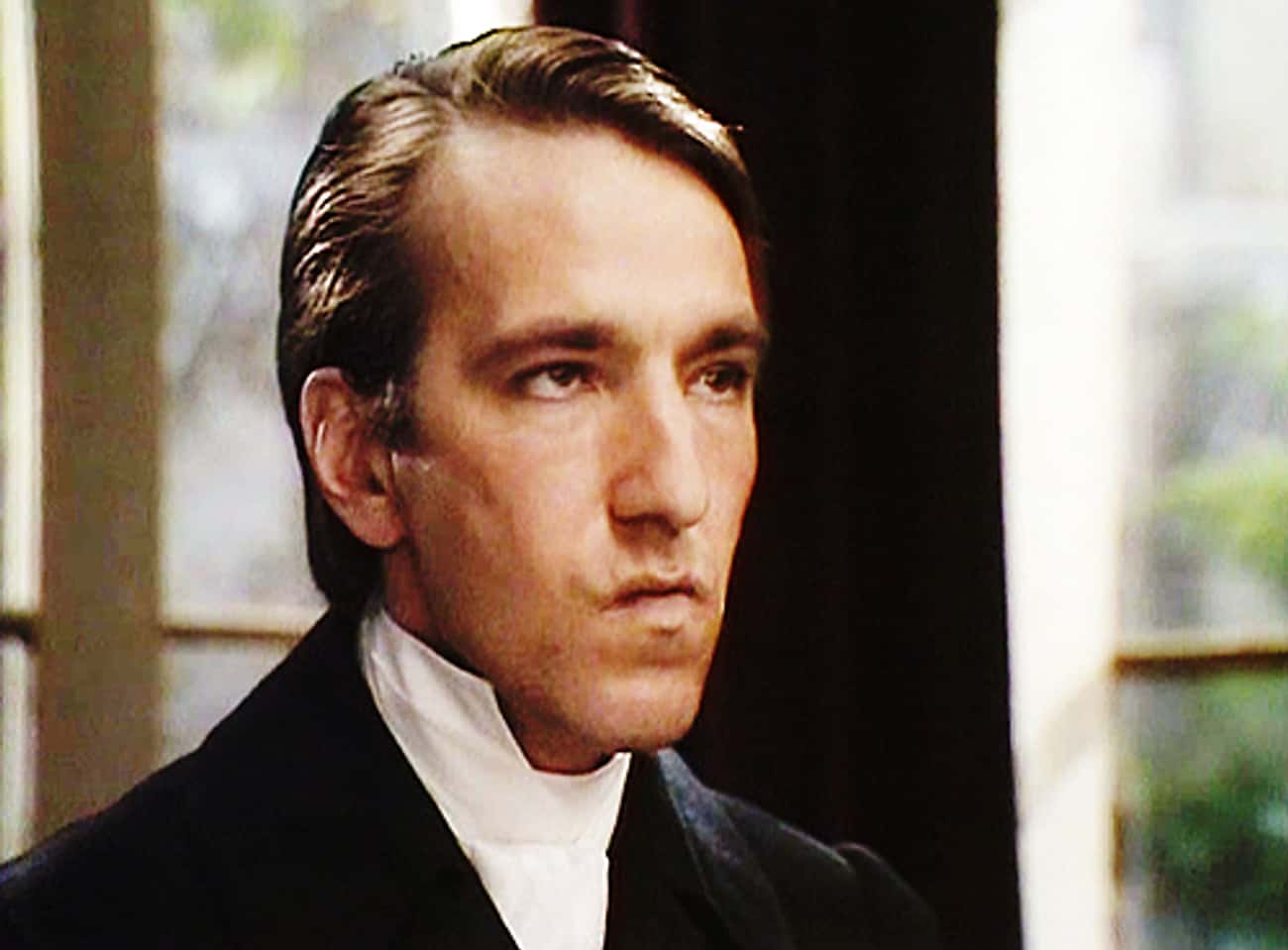 Young Alan Rickman in Black Coat with White Collar