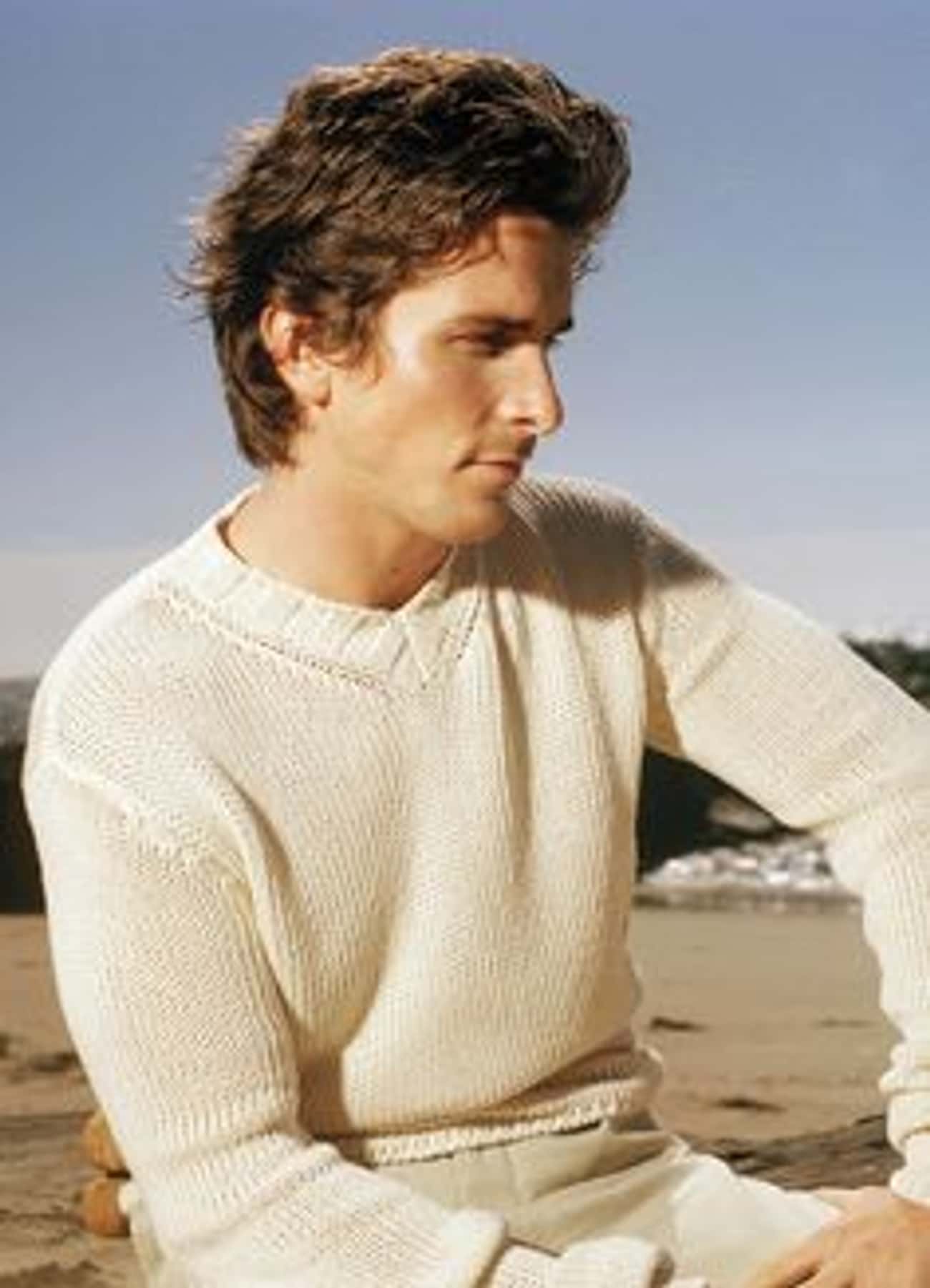 Young Christian Bale in White V-Neck Sweater