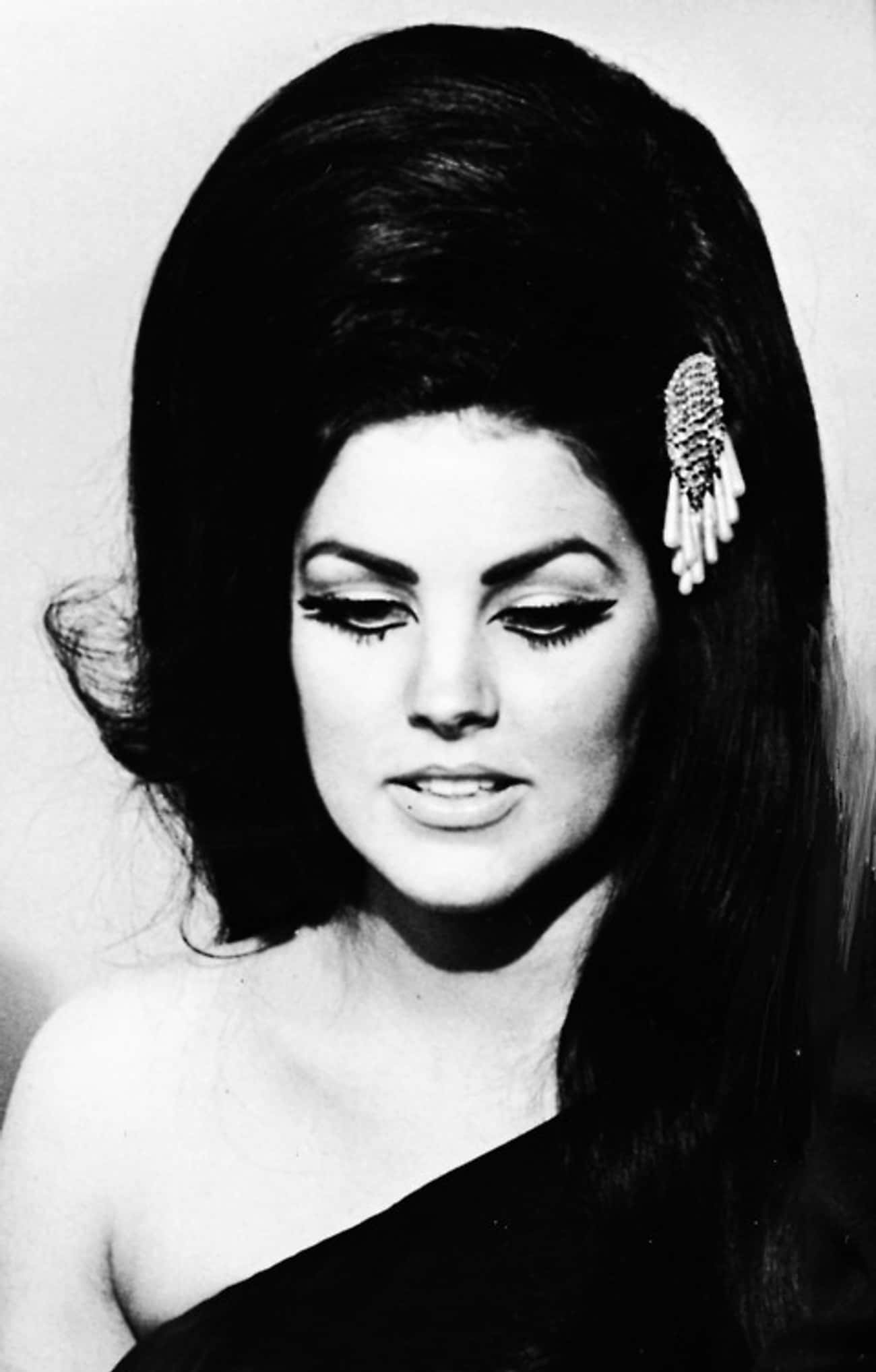 Young Priscilla Presley in a Black Evening Gown