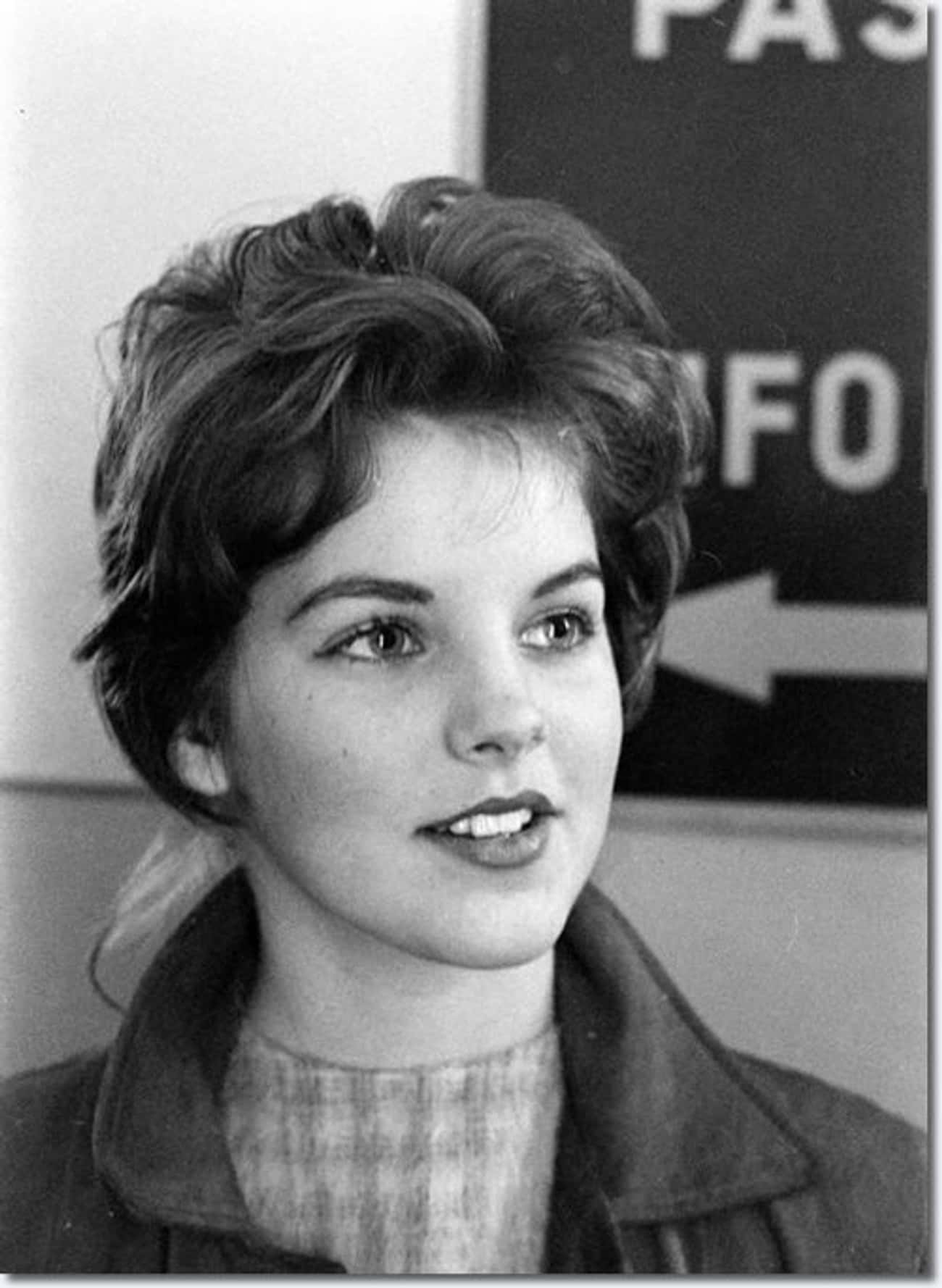 Young Priscilla Presley in a Gray Coat and Turtleneck