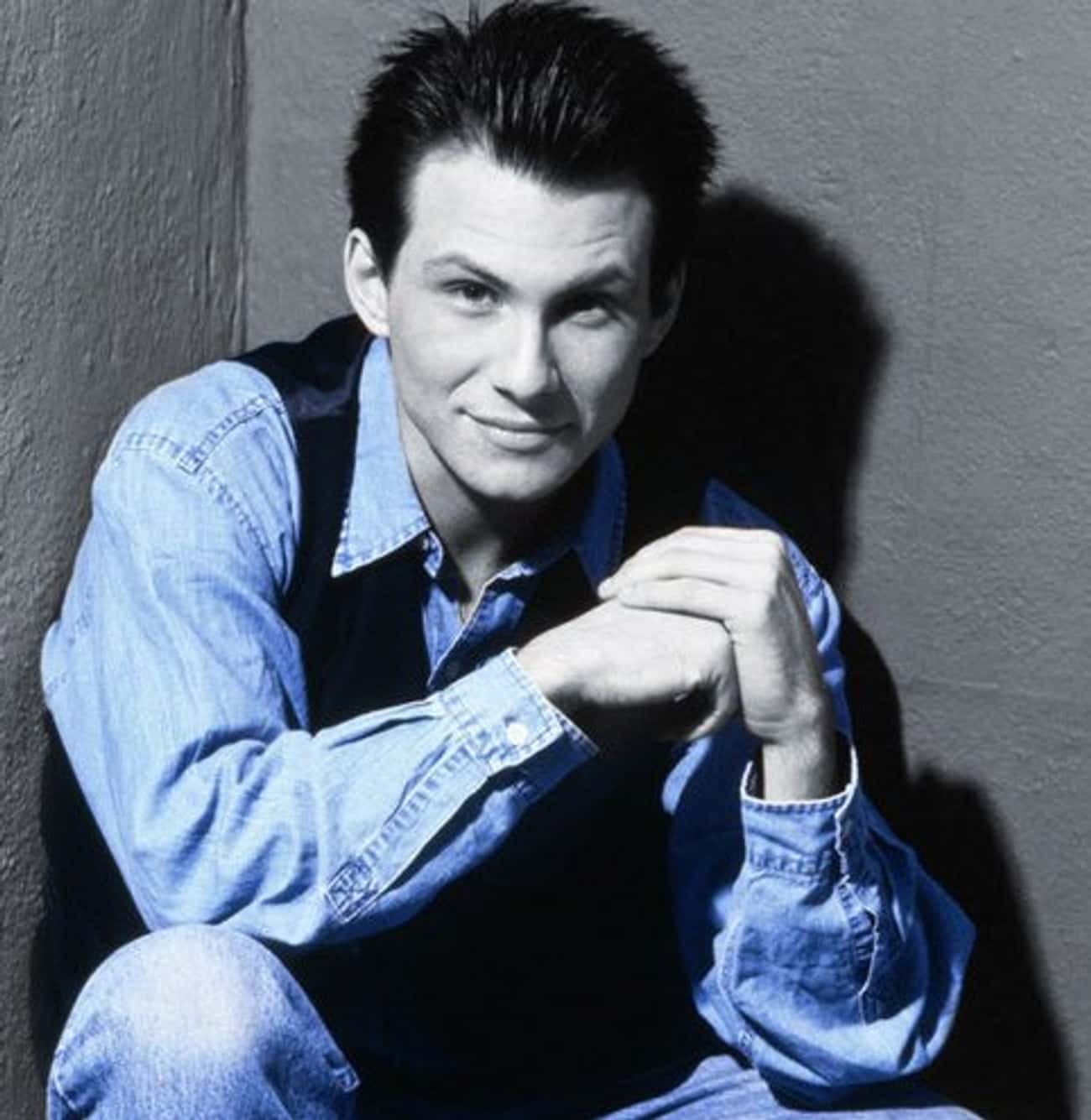 Young Christian Slater in Blue Jean Buttondown and Black Vest