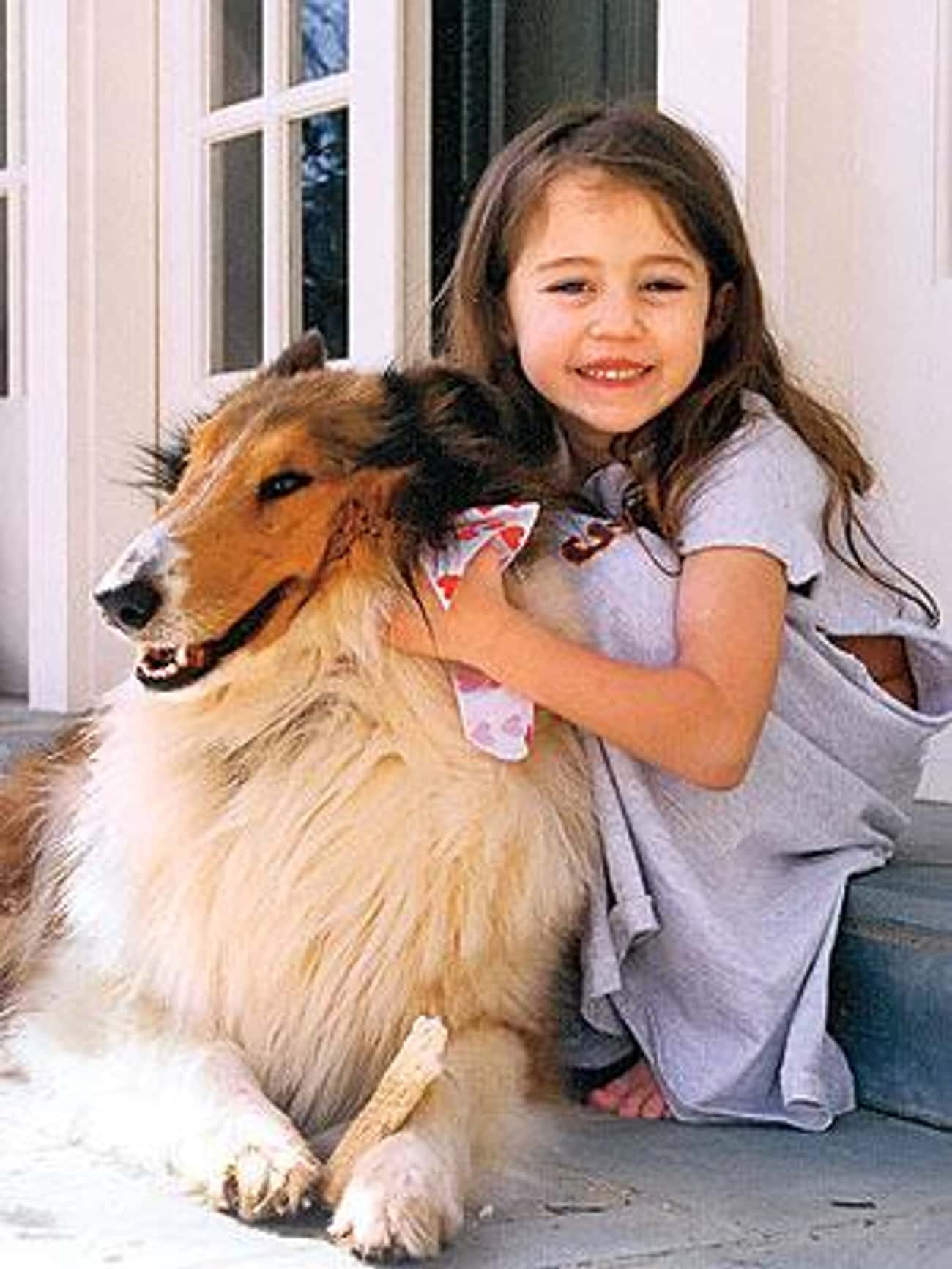 Young Miley Cyrus with Her Dog Pawnie