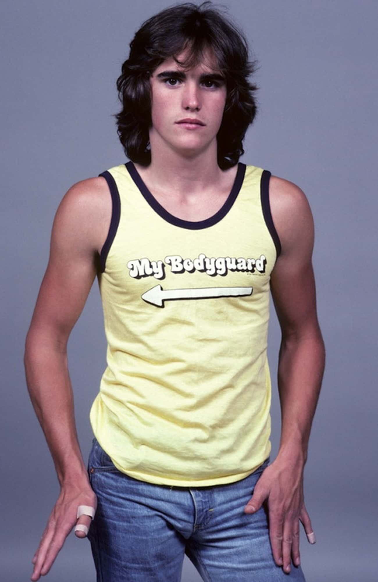 Young Matt Dillon in Yellow Printed Tank Top and Jeans