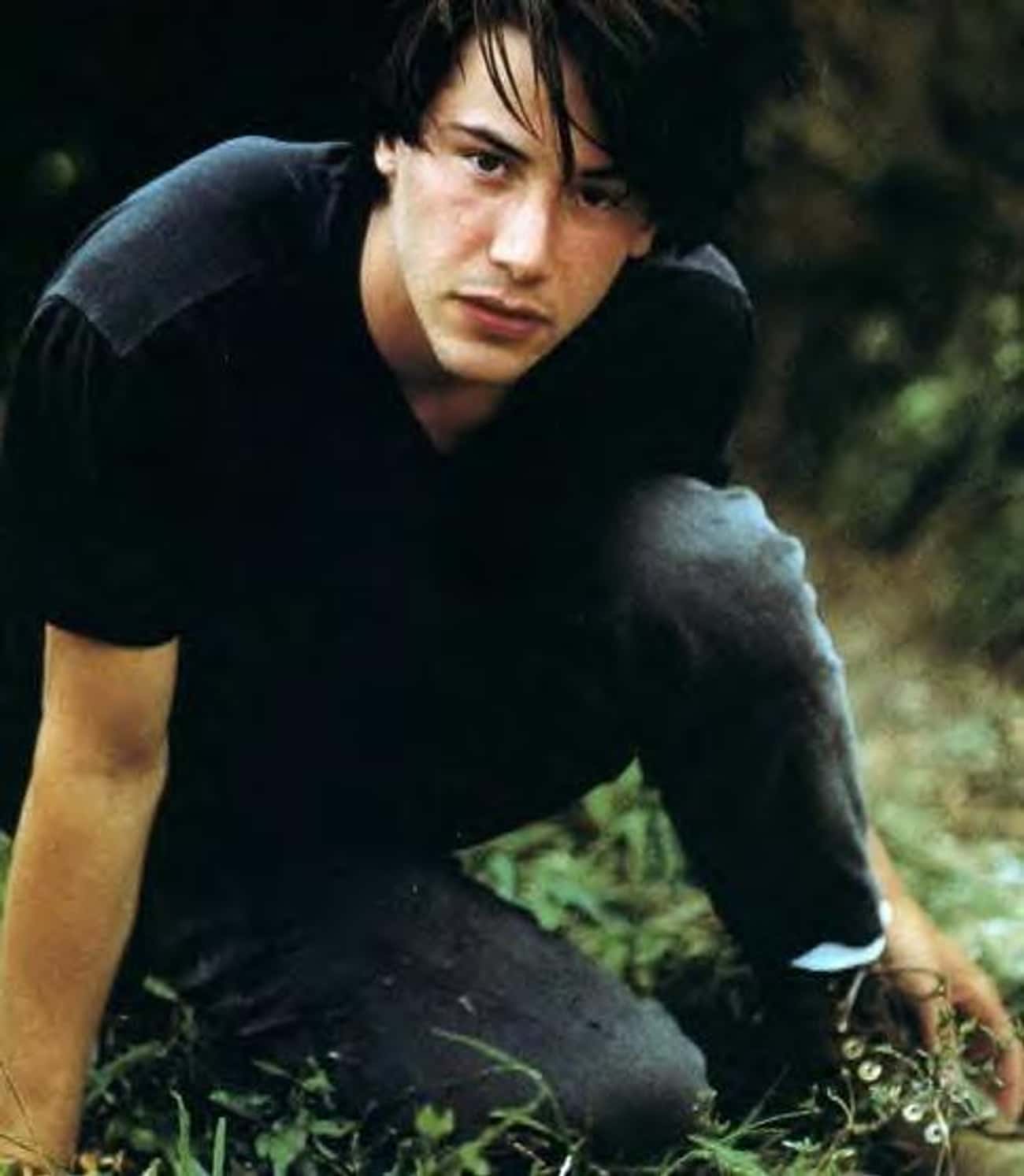 Young Keanu in Black V-Neck T-Shirt and Dark Jeans