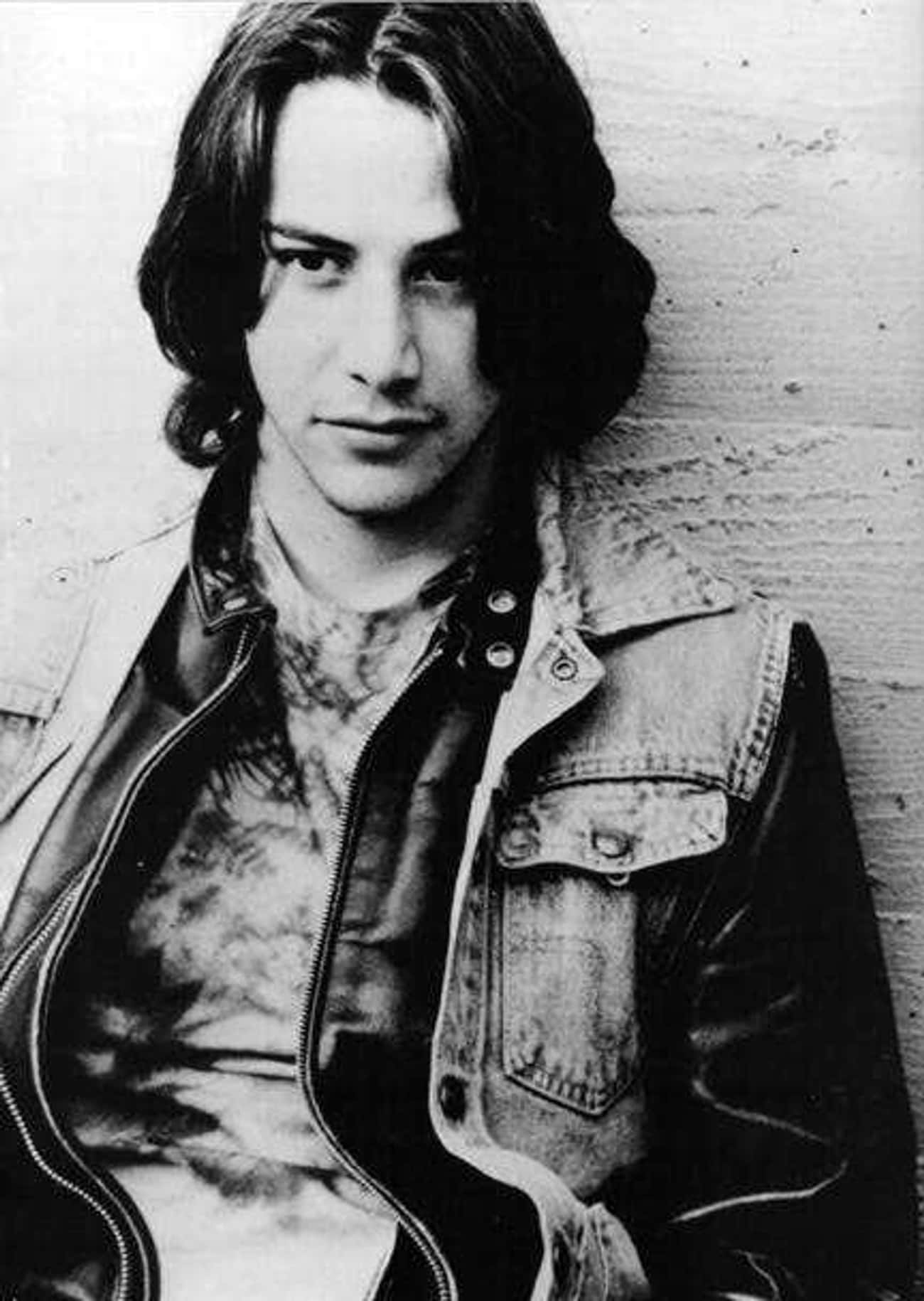 Young Keanu Reeves in Black Leather Jacket with Blue Jean Vest