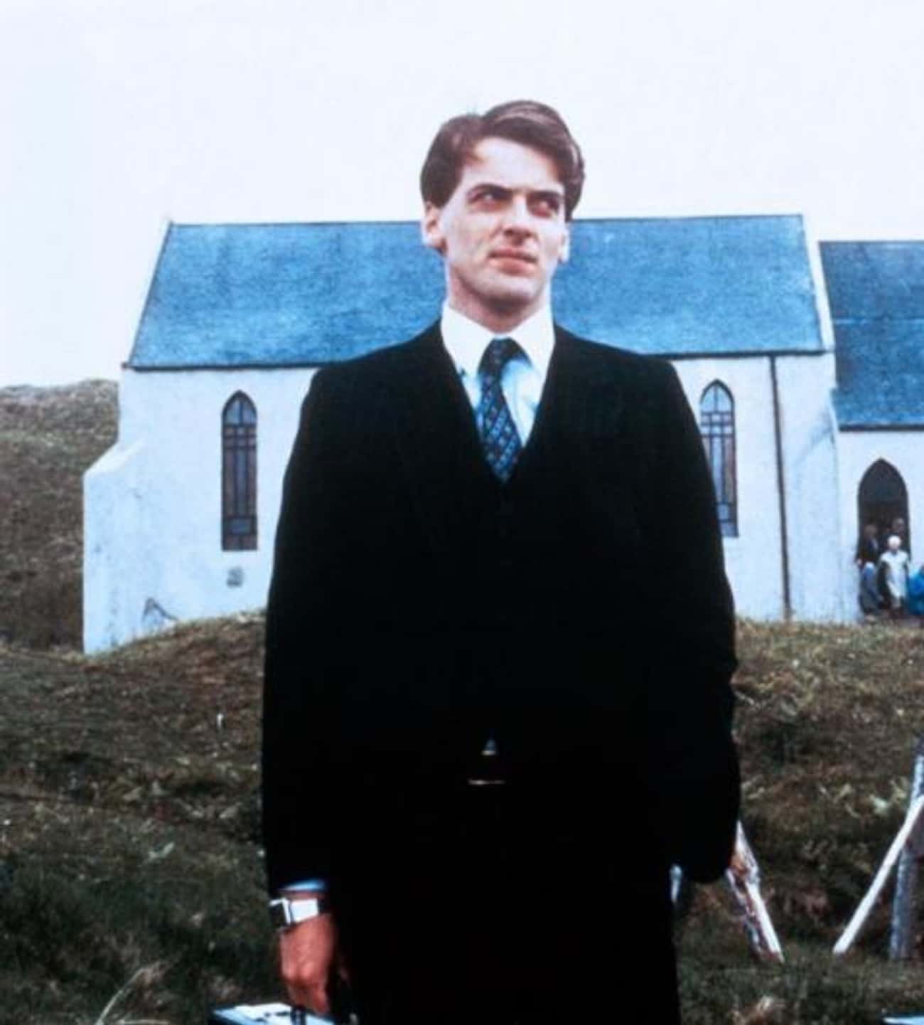 Young Peter Capaldi in Black Suit with Blue Tie