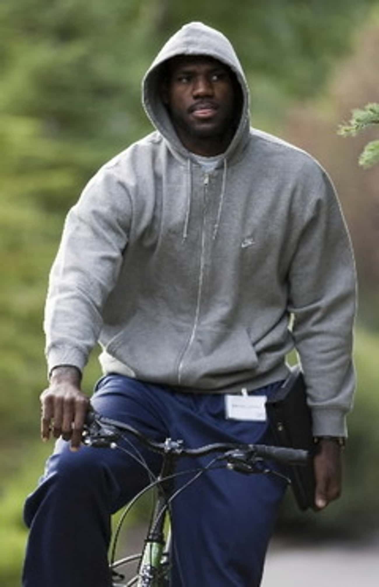 Young LeBron James in Gray Hoodie Riding Bicycle