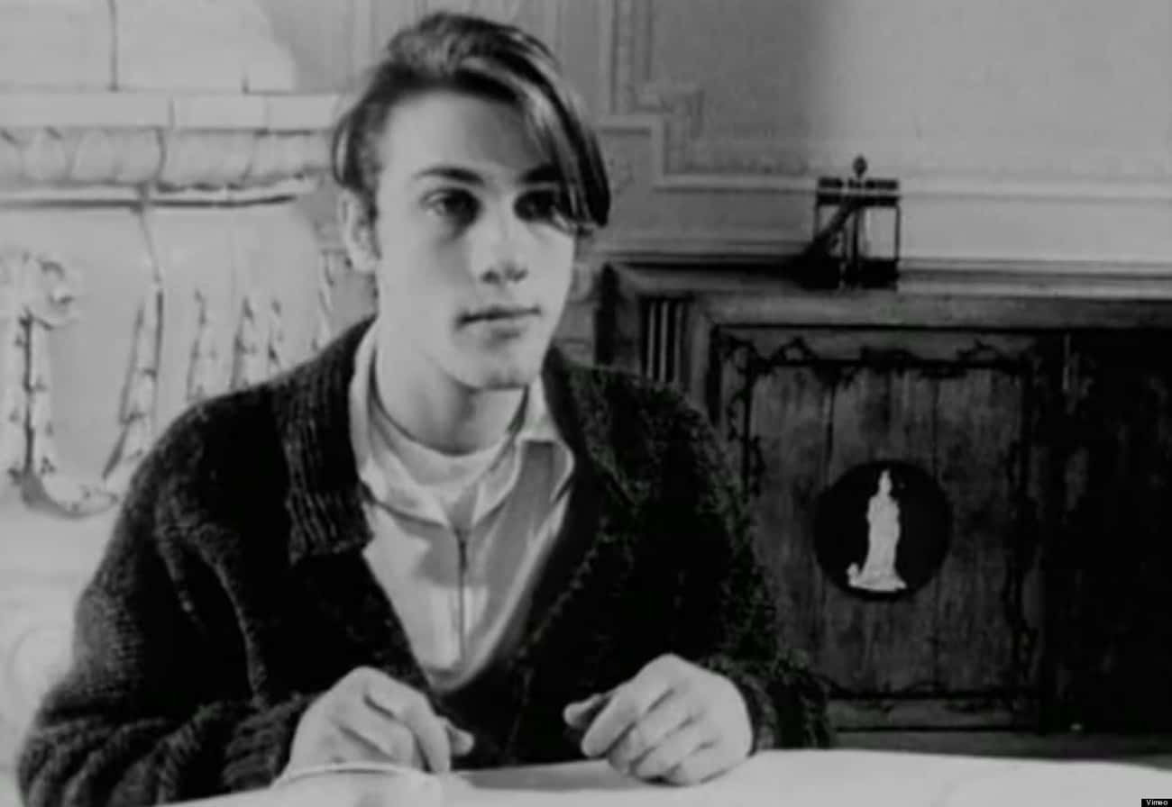 Young Christoph Waltz in Black Wool Coat and White Polo