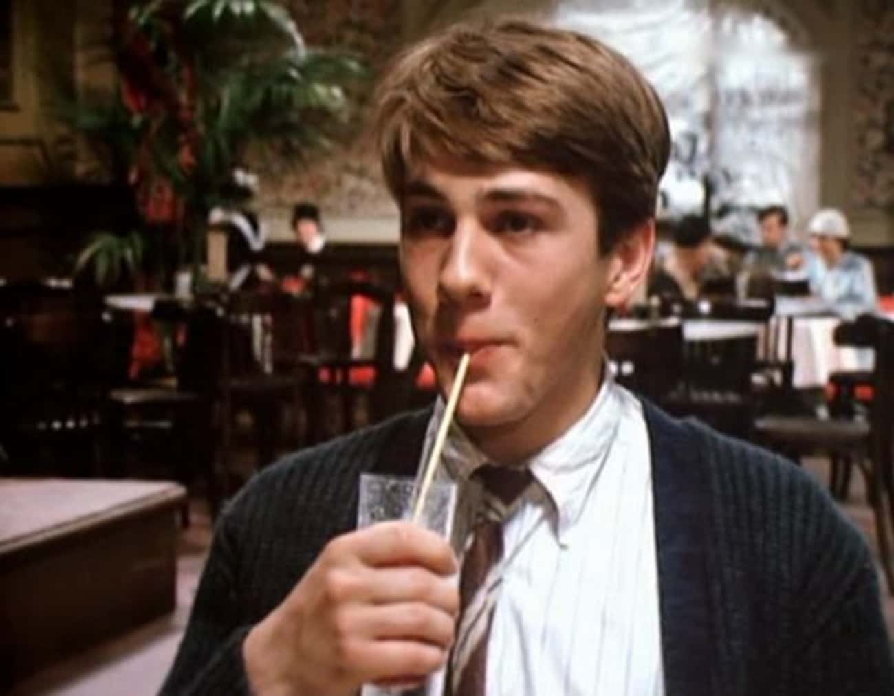 Young Christoph Waltz in Gray Sweater, Buttondown Shirt and Tie