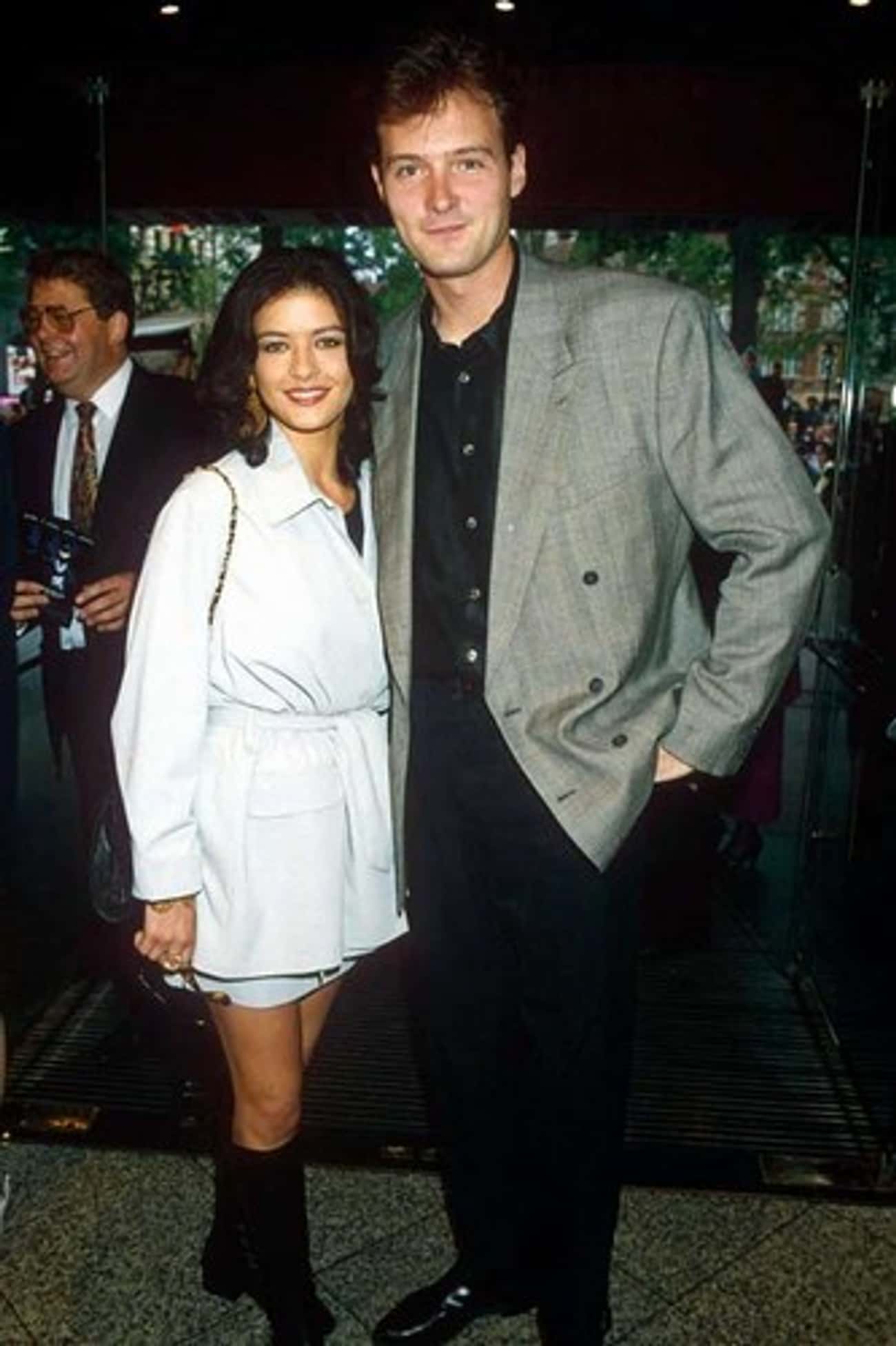 Young Catherine Zeta-Jones in White Dress and Black Boots